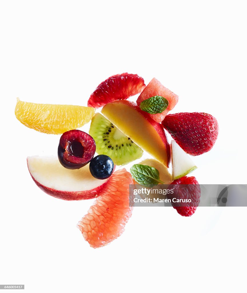Fruit salad ingredients on white