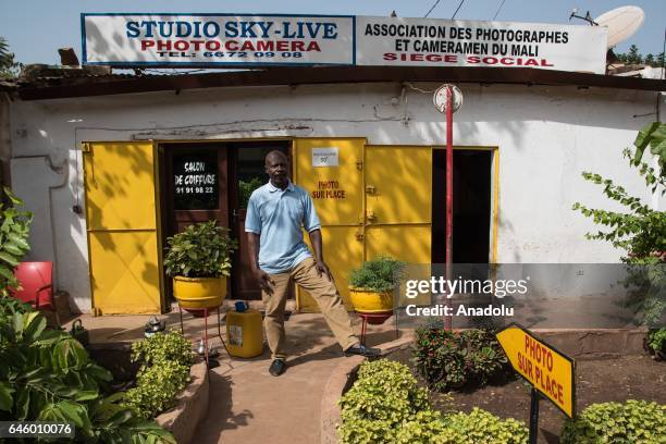 Sekou Madani Traore poses in front of his photo studio named Sky-Live, which was founded in 1992, in the Hamdallaye region of Bamako, Mali on...