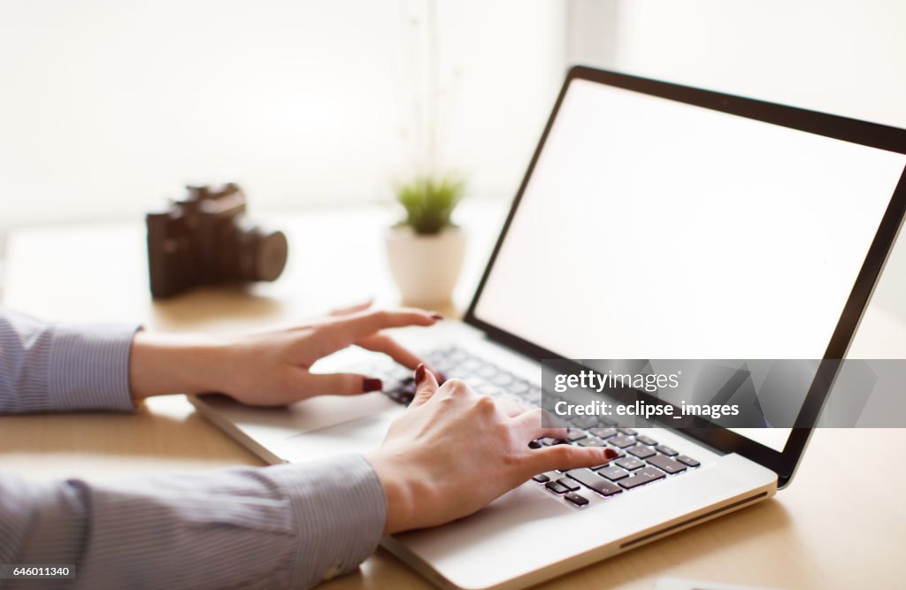 Close up of woman using laptop