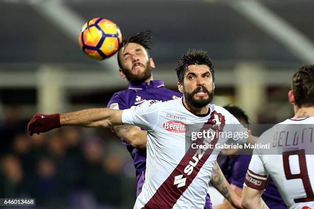 Gonzalo Rodriguez of ACF Fiorentina battles for the ball with Marco Benassi of FC Torino during the Serie A match between ACF Fiorentina and FC...