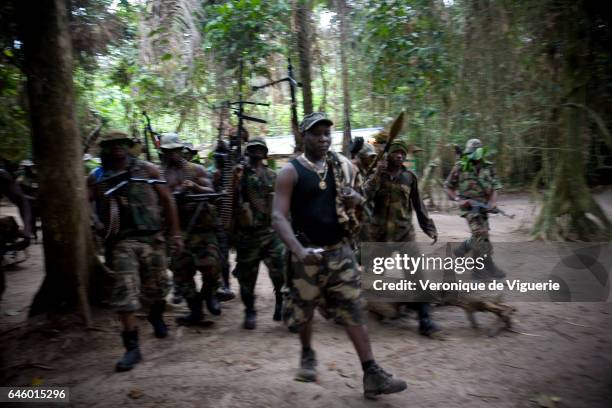 Ateke Tom, the big chief of the MEND , with his recruits, in one of the eleven camps he rules in the mangroves of the Niger delta.