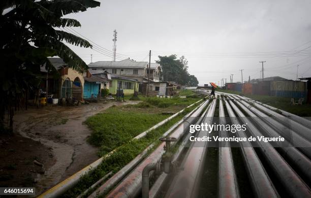 Pipelines running through the middle of Okrika village. The older pipelines sometimes leak or burst. The most recent incident two months ago caused...