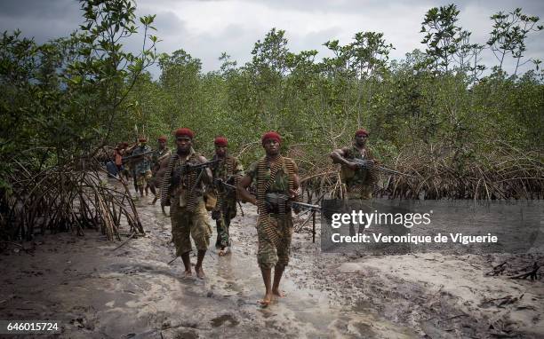 Militants working under Ateke Tom, the big chief of the MEND , travelling to camp nine, which is just one of the eleven camps he rules in the...