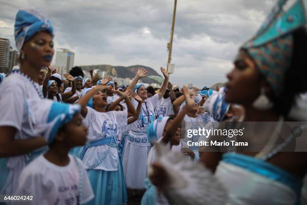 Revelers prepare to march in the Afoxe Filhos de Gandhi and Afoxe Razes Africanas combined 'bloco', or street party, on the fourth official day of...