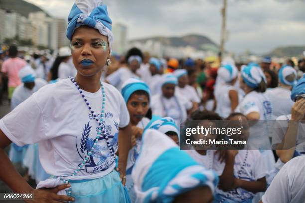 Revelers prepare to march in the Afoxe Filhos de Gandhi and Afoxe Razes Africanas combined 'bloco', or street party, on the fourth official day of...