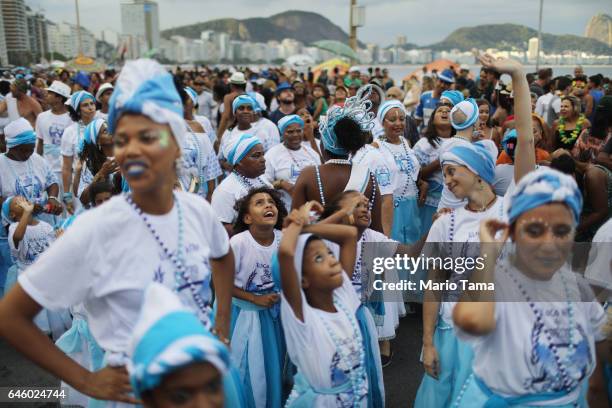 Revelers prepare to march in the Afoxe Filhos de Gandhi and Afoxe Razes Africanas combined 'bloco', or street party, on the fourth official day of...