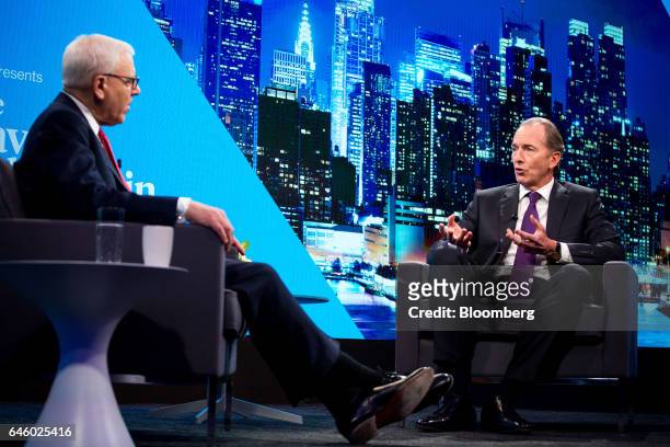 James Gorman, chief executive officer of Morgan Stanley, right, speaks as David Rubenstein, co-chief executive officer of the Carlyle Group LP,...