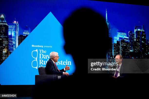 David Rubenstein, co-chief executive officer of the Carlyle Group LP, left, speaks as James Gorman, chief executive officer of Morgan Stanley,...
