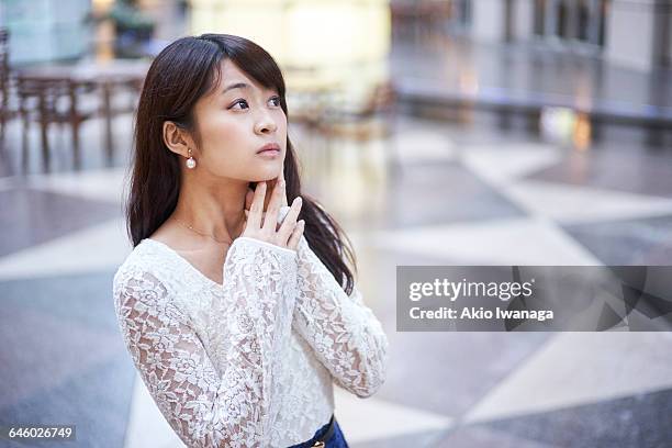 women who indulge in thought on the terrace - kanten bloes stockfoto's en -beelden