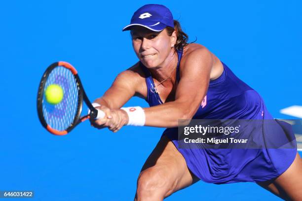 Varvara Lepchenko of USA takes a backhand shot during a first round match between Kristina Mladenovic of France and Varvara Lepchenko of USA as part...