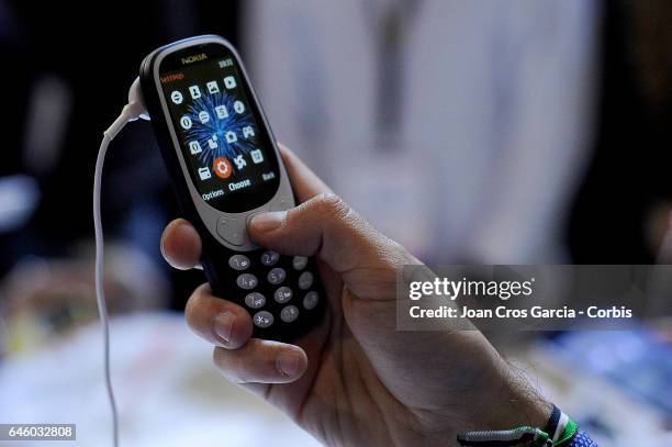 Congress attendee testing the new Nokia 3310 during the Mobile World Congress, on February 27, 2017 in Barcelona, Spain.