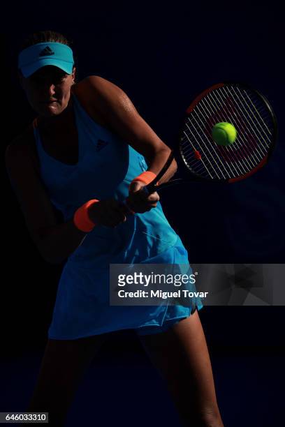 Kristina Mladenovic of France takes a backhand shot during a first round match between Kristina Mladenovic of France and Varvara Lepchenko of USA as...