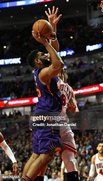 Alan Williams of the Phoenix Suns goes up against Robin Lopez of the Chicago Bulls at the United Center on February 24, 2017 in Chicago, Illinois....