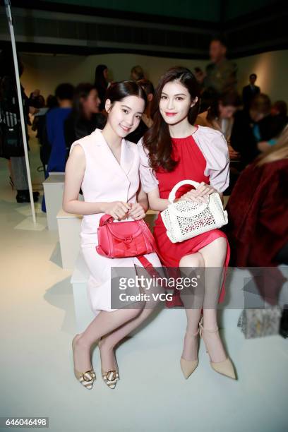 Cellist Nana Ou-yang and Model Sui He attend Ferragamo show during Milan Fashion Week Fall/Winter 2017/18 on February 26, 2017 in Milan, Italy.