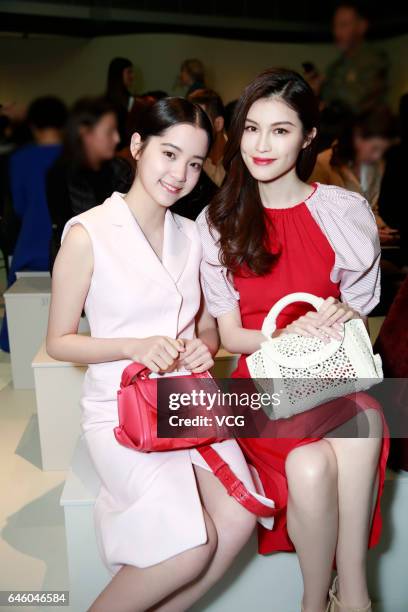 Cellist Nana Ou-yang and Model Sui He attend Ferragamo show during Milan Fashion Week Fall/Winter 2017/18 on February 26, 2017 in Milan, Italy.