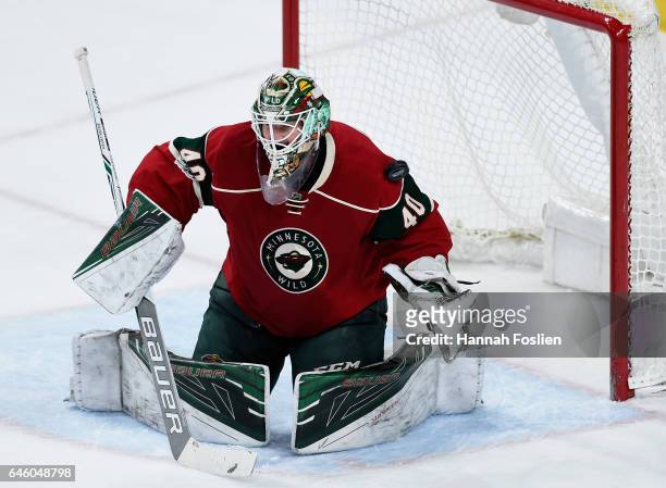 Shot by Tanner Pearson of the Los Angeles Kings deflects off Devan Dubnyk of the Minnesota Wild and into the net to score during the first period of...