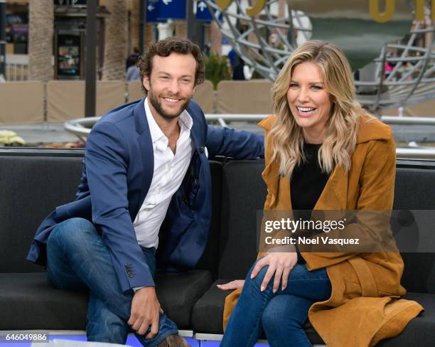 Kyle Schmid and Charissa Thompson visit "Extra" at Universal Studios Hollywood on February 27, 2017 in Universal City, California.