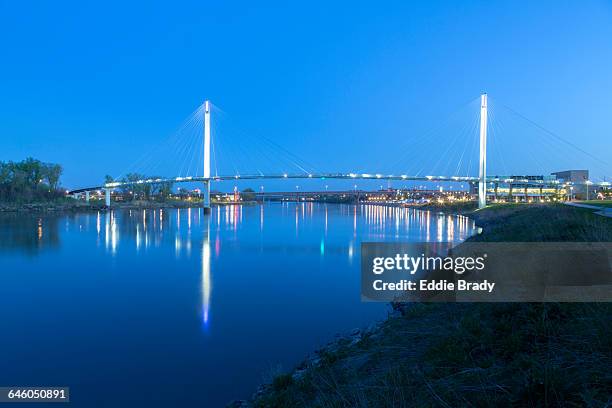 bob kerrey pedestrian bridge at dusk - missouri river stock pictures, royalty-free photos & images
