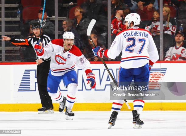 Max Pacioretty of the Montreal Canadiens celebrates the game winning power play goal by Alex Galchenyuk at 2:54 of overtrime against the New Jersey...