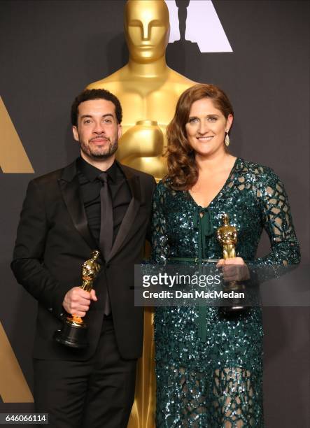 Director Ezra Edelman and producer Caroline Waterlow, winners of Best Documentary Feature for 'O.J.: Made in America' pose in the press room at the...