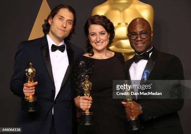 Jeremy Kleiner, Adele Romanski and Barry Jenkins pose in the press room with award for Best Picture for 'Moonlight,' at the 89th Annual Academy...