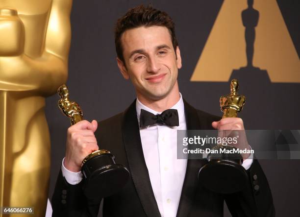 Composer Justin Hurwitz, winner of Best Original Score and Best Original Song for 'La La Land' poses in the press room at the 89th Annual Academy...
