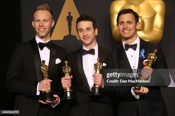 Songwriters Justin Paul, Justin Hurwitz and Benj Pasek, winners of the Best Original Song award for 'City of Stars' pose in the press room at the...