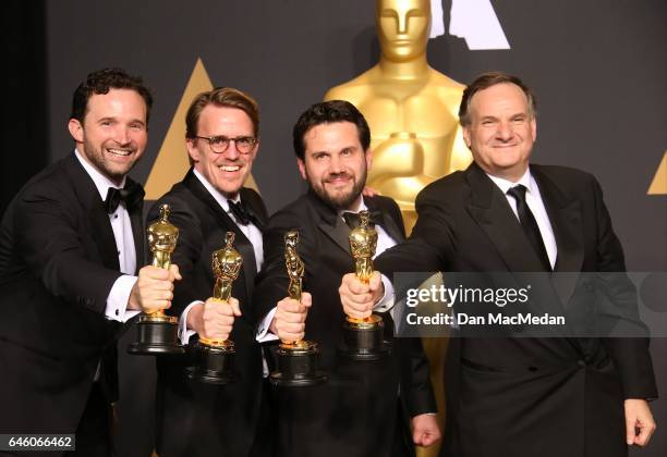 Visual effects artists Dan Lemmon, Andrew R. Jones, Adam Valdez and Robert Legato, winners of Best Visual Effects for 'The Jungle Book' pose in the...