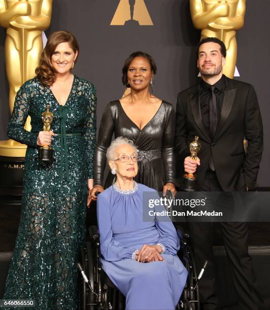 Mathematician Katherine Johnson and director Ezra Edelman and producer Caroline Waterlow , winners of Best Documentary Feature for 'O.J.: Made in...