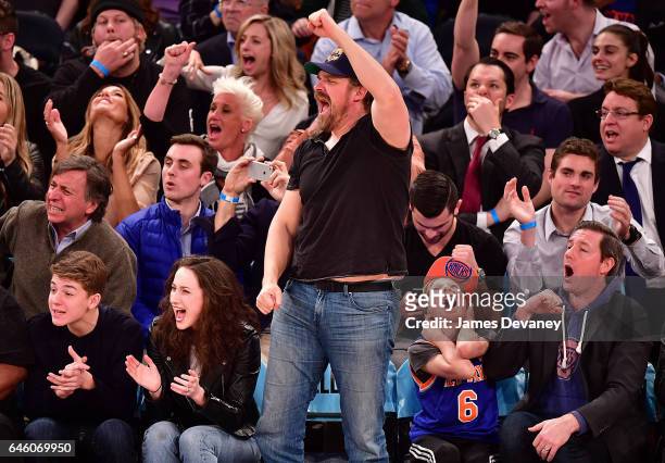 David Harbour, Finn Burns and Ed Burns attend Toronto Raptors Vs. New York Knicks game at Madison Square Garden on February 27, 2017 in New York City.