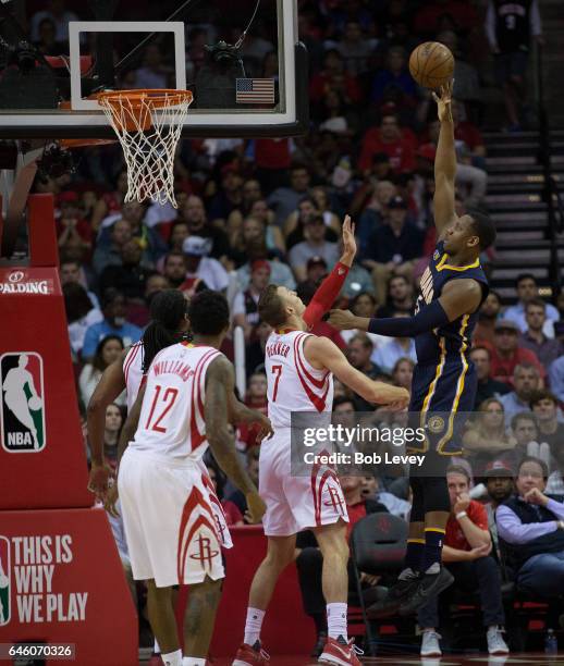 Lavoy Allen of the Indiana Pacers shoots over Sam Dekker of the Houston Rockets as Louis Williams looks on at Toyota Center on February 27, 2017 in...