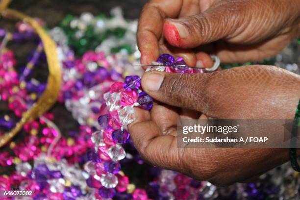 close-up of a woman preparing bracelet - bead stock pictures, royalty-free photos & images