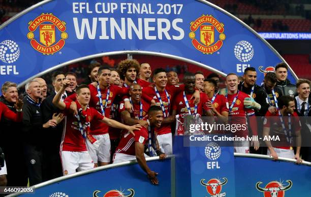 Manchester United celebrate with the trophy during the EFL Cup Final match between Manchester United and Southampton at Wembley Stadium on February...