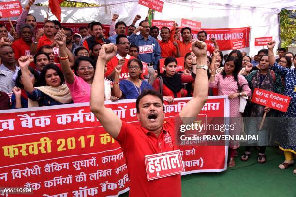 Indian bank employees protest during a nationwide strike in Bhopal on February 28, 2017. - Banking unions called for the strike by employees of...