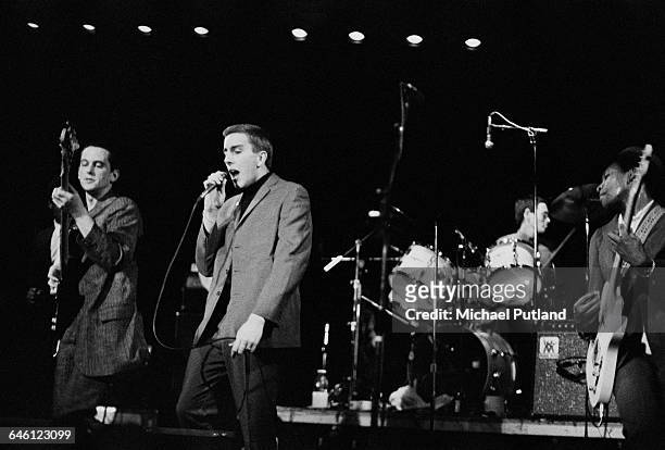 English ska revival band, The Specials, performing in Los Angeles, March 1980. Left to right: Horace Panter, Terry Hall, John Bradbury and Neville...