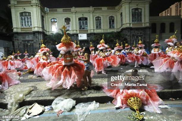 Revelers from the Portela samba school wait to perform outside the Sambodrome in the early morning hours during Carnival festivities on February 28,...