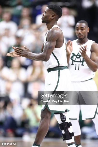 Eron Harris of the Michigan State Spartans who suffered a season-ending knee injury, checks into the game to kiss the midcourt logo on senior day...