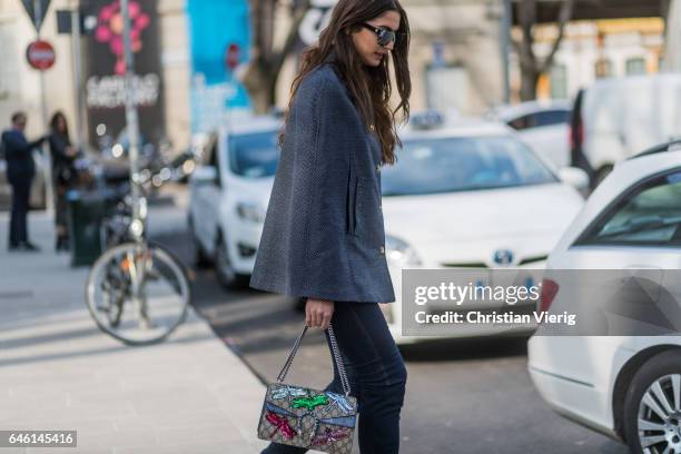 Sara Rossetto wearing a grey cape, denim jeans, Gucci bag outside Armani during Milan Fashion Week Fall/Winter 2017/18 on February 27, 2017 in Milan,...