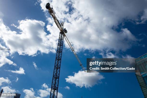 Construction crane silhouetted against a cloudy blue sky in the Mission Bay/Potrero Hill neighborhood of San Francisco, California, October 18, 2016....