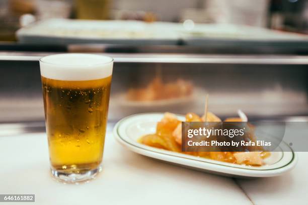 beer and spanish tapa - madrid tapas stock pictures, royalty-free photos & images