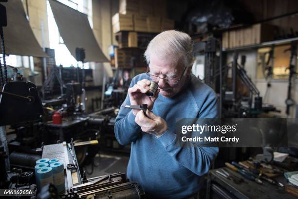 Printer Stan Lane checks the lettering produced by a composition caster at Gloucester Typesetting Services in Stonehouse, on February 27, 2017 in...