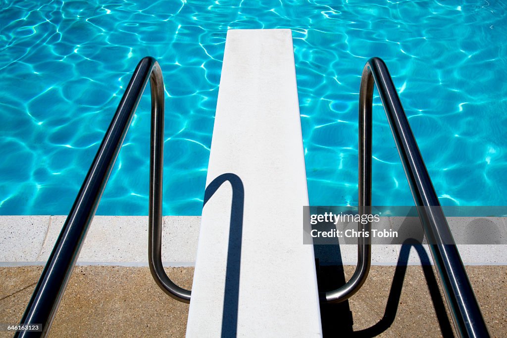 Diving board at swimming pool