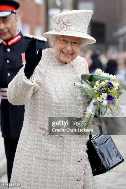 Queen Elizabeth II departs from The Charterhouse as she and Prince Philip, Duke of Edinburgh open a new development at Charterhouse Square on...