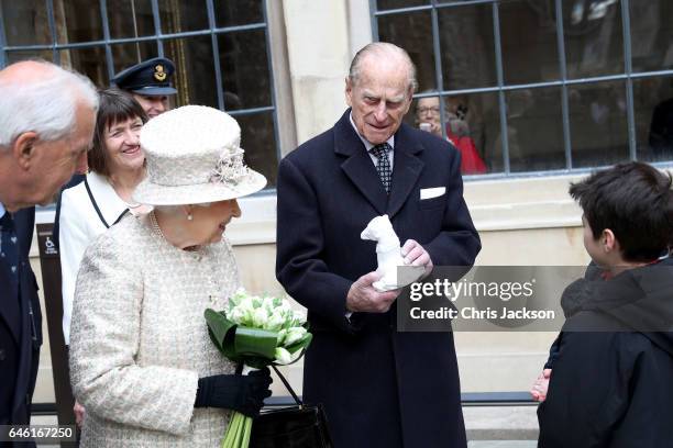 Queen Elizabeth II and Prince Philip, Duke of Edinburgh are greeted by local school children as they open a new development at The Charterhouse at...