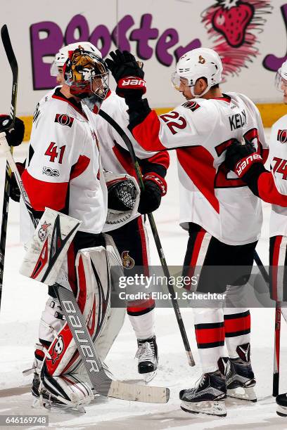 Goaltender Craig Anderson of the Ottawa Senators celebrates with teammate Chris Kelly their 2-1 win against the Florida Panthers at the BB&T Center...