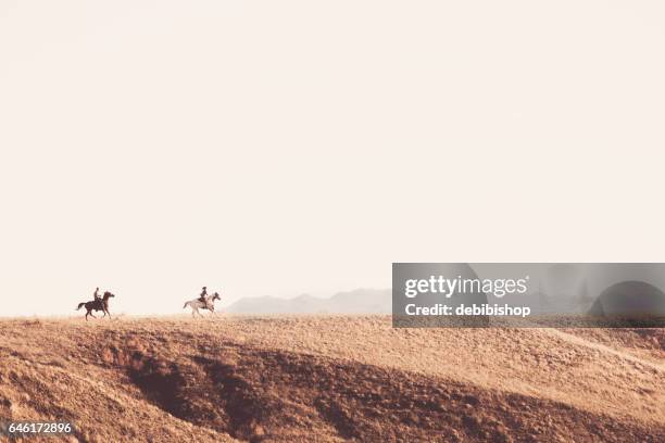 people on horseback outdoors - trail ride stock pictures, royalty-free photos & images