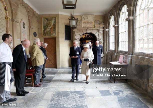 Queen Elizabeth II and Prince Philip, Duke of Edinburgh greet Almshouse residents as they open a new development at The Charterhouse at Charterhouse...