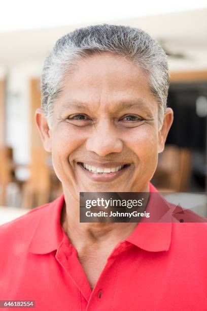 portrait of cheerful senior man looking at camera - tee srilanka stock pictures, royalty-free photos & images