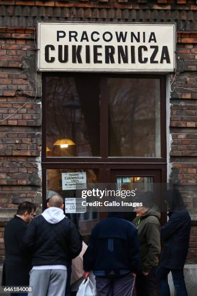 People standing in line in front of a bakery during Fat Thursday on February, 23 in Warsaw, Poland. Fat Thursday is a traditional Catholic Christian...