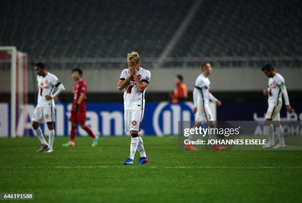 Western Sydney Wanderers' midfielder Mitch Nichols reacts after the AFC Asian Champions League group football match between China's Shanghai SIPG and...